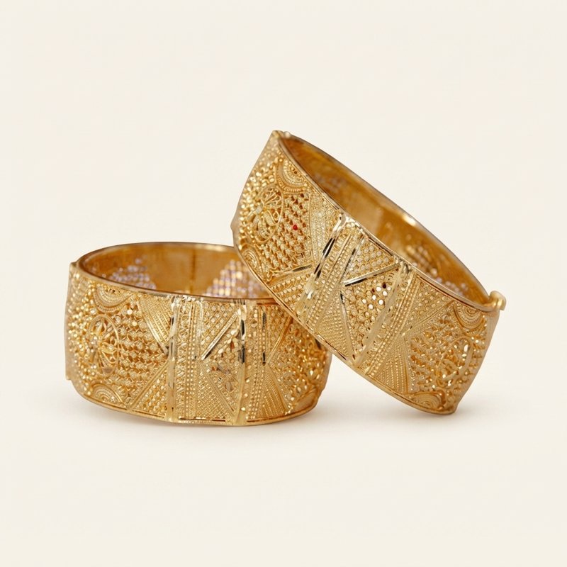Pair of engraved gold bangles