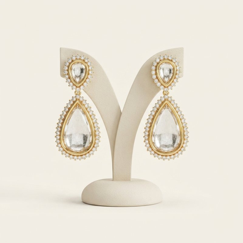 Gold crystal drop earrings with pave halo setting
